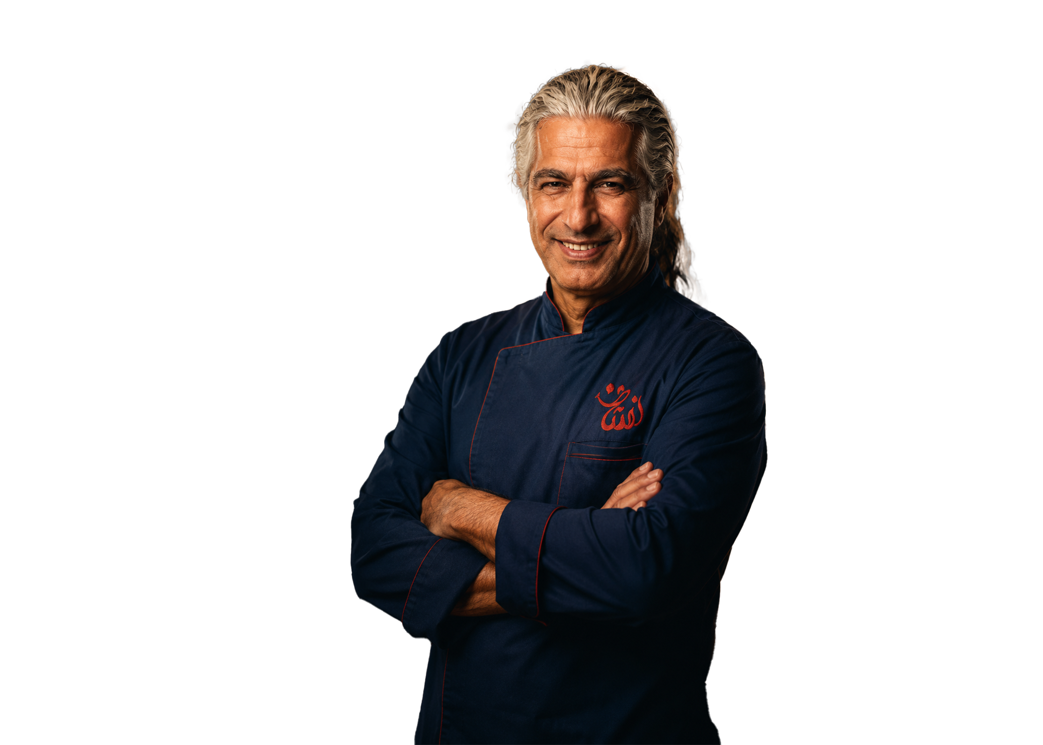 Reza Neshat founder Mr Neshat Persian BBQ restaurant Port Coquitlam BC smiling in navy chef jacket